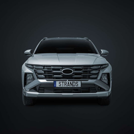 Hyundai Tucson SUV with Strands NUUK E-LINE BLACK 20-inch LED light bar installed on the roof.